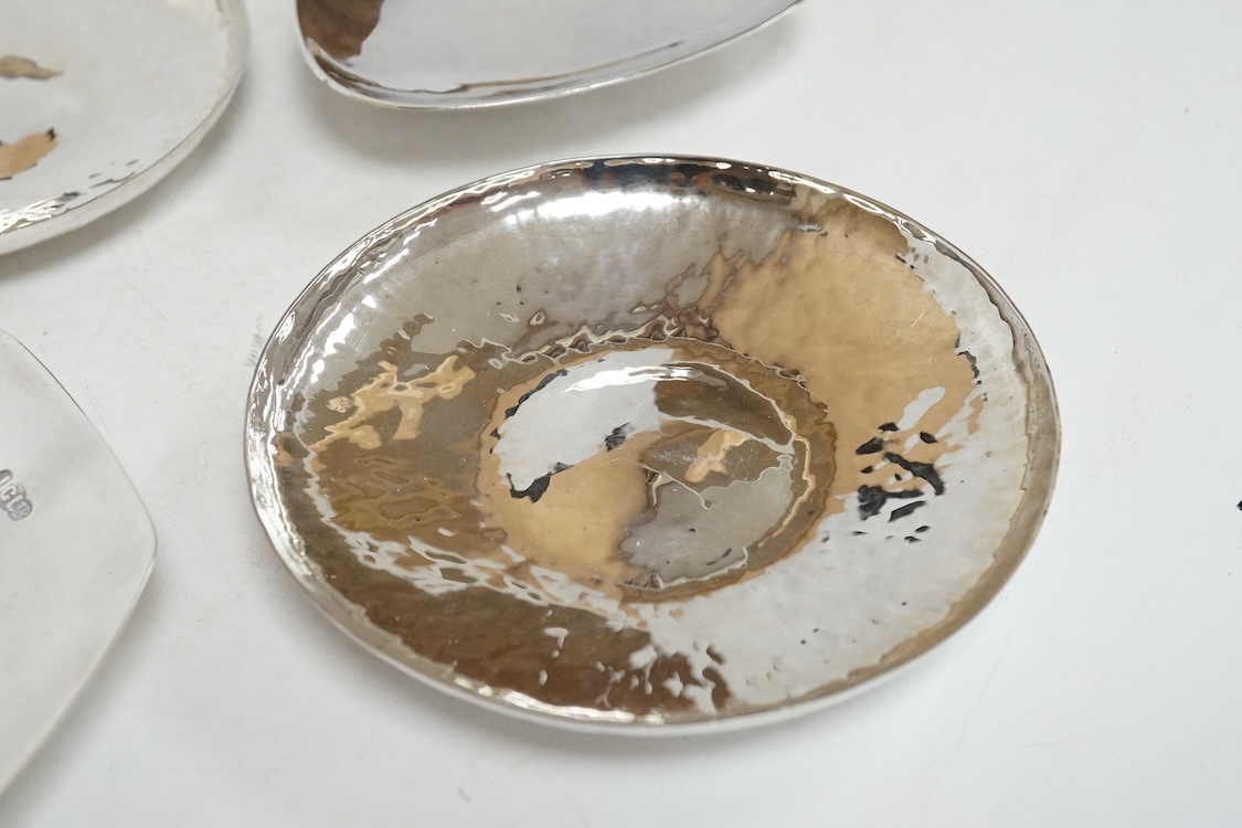 Three contemporary silver pin dishes including a planished pair by Paul Victor Markey, diameter 10.1cm and one by Robert Edgar Stone, together with a modern silver coin dish, 8.3oz.